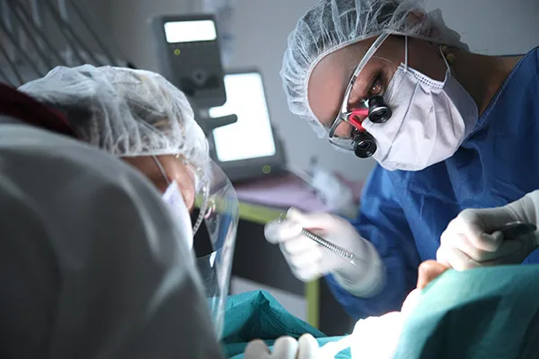 surgeons working on patient